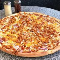 West Side BBQ Chicken Pizza · Smokey BBQ sauce pizza with red onions, BBQ chicken and topped with cheddar cheese.