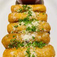 Mozzarella Fritta · Deep-fried mozzarella sticks served with our delicious marinara sauce.