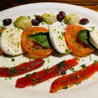 Caprese · Fresh Buffalo mozzarella over fresh sliced tomatoes, artichoke hearts, roasted red peppers, ...