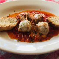Mario's Meatballs · Four house made meatballs in marinara sauce topped with melted mozzarella served with toaste...