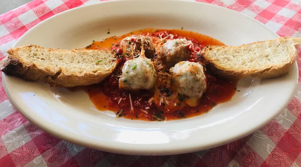 Mario's Meatballs · Four house made meatballs in marinara sauce topped with melted mozzarella served with toasted ciabatta bread.