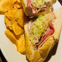 Italian Hoagie Sandwich · Ham, capocollo, salami, provolone, tomatoes, lettuce, onions, dressing, and seasoning, serve...