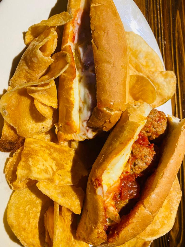 Meatball Sandwich · Our famous meatballs topped with marinara sauce and melted mozzarella served on a fresh Italian roll with our house-made chips.