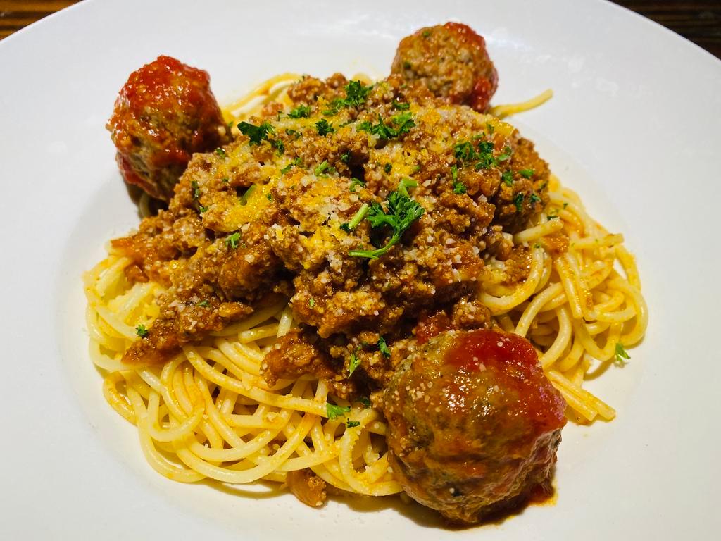 Spaghetti Bolognese · In our delicious meat sauce. Add meatballs or sausage for an additional charge.Your Choice of Soup or Salad & Garlic Bread