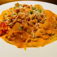 Capellini Campagnola · Angel hair pasta tossed with ground sausage, red and green peppers, onions and mushrooms sau...