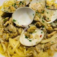 Linguine Vongole · Littleneck clams sauteed with garlic, extra-virgin olive oil, and white wine, served over li...