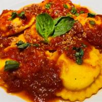 Ravioli di Formaggio · Mario's handmade ravioli filled with ricotta, mascarpone, Parmagiano and mozzarella topped w...