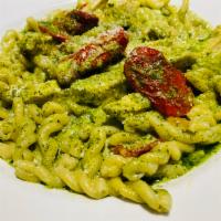 Gemelli al Pesto · House made twisted pasta with grilled chicken and sun-dried tomatoes in our creamy pesto sau...