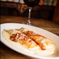 Cannelini Rossini · Large house-made pasta crepes filled with ground veal, chicken, and ricotta, rolled and bake...