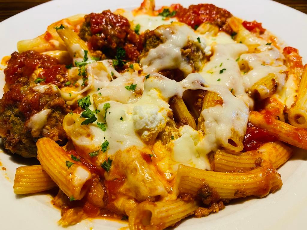Maccheroni al Forno · Mario's handmade maccheroni pasta, in a light meat sauce with meatballs, baked with mozzarella and ricotta. Your Choice of Soup or Salad & Garlic Bread.