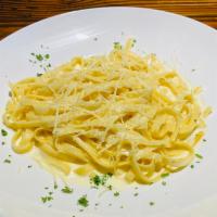 Fettuccine Alfredo · Fettuccine pasta tossen in a creamy Alfredo sauce. Add Chicken and shrimp for an additional ...