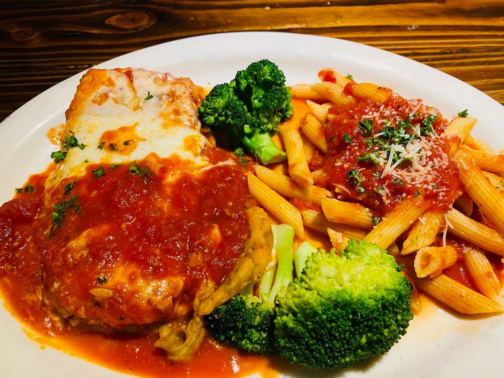 Eggplant Parmigiana · Sliced eggplant layered with marinara and pecorino baked with melted mozzarella served with a penne marinara and broccoli.Your Choice of Soup or Salad & Garlic Bread.