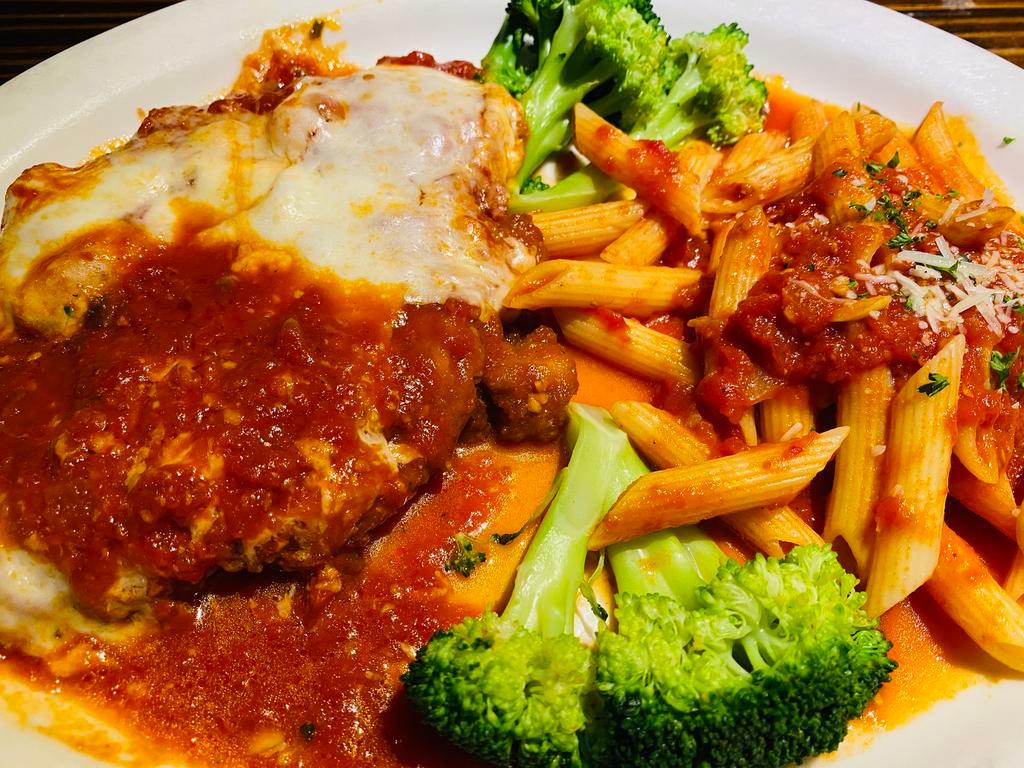 Chicken Parmigiana · Breast of chicken breaded and baked with marinara and mozzarella served with penne marinara and broccoli. Your Choice of Soup or Salad & Garlic Bread.