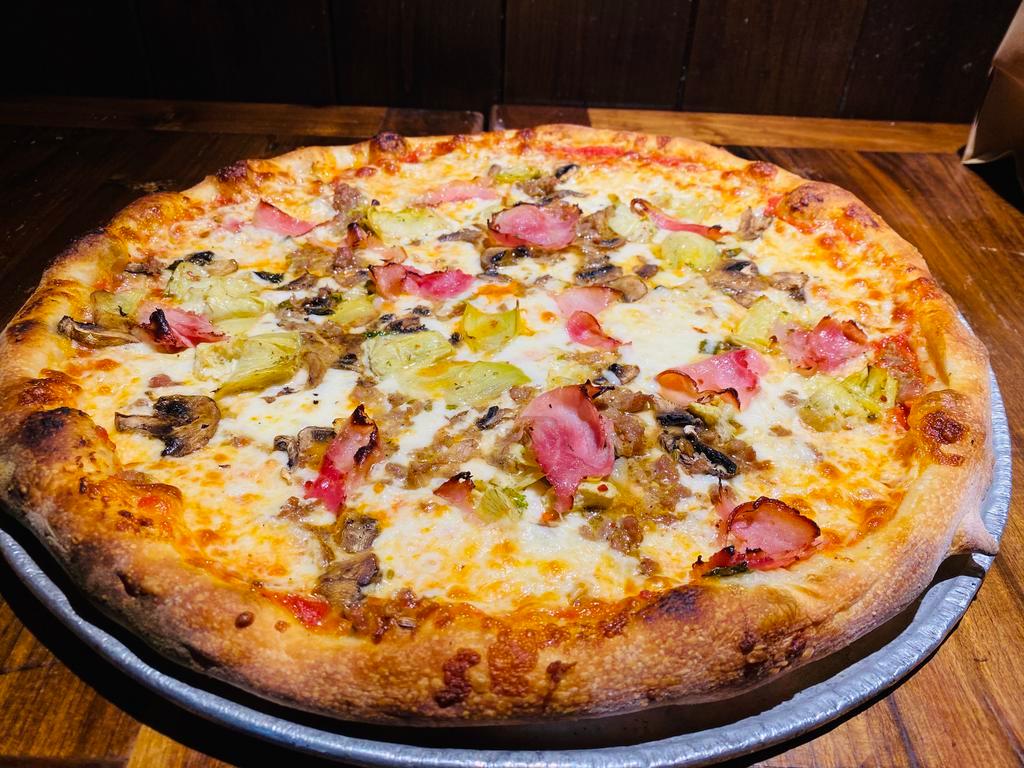 Quatro Stagioni Specialty Pizza · Ham, artichokes, mushrooms, sausage, cheese, and sauce.
Any additional toppings will result in an upcharge. 