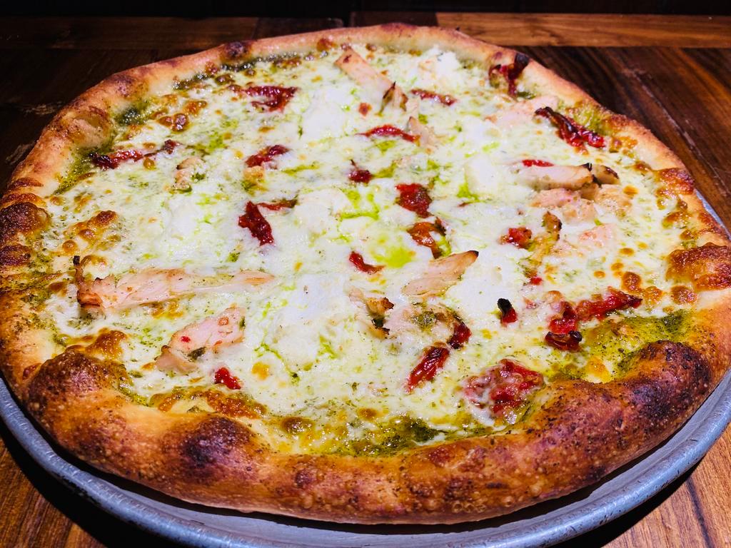 Pizza al Pesto Specialty Pizza · Our delicious pesto sauce, garlic, basil, grilled chicken, sun-dried tomatoes, and ricotta.
Any additional toppings will result in an upcharge. 