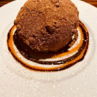 Chocolate Tartufo · Zambaione cream center surrounded by chocolate gelato and caramelized hazelnuts topped with ...