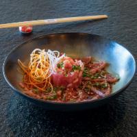 Tuna Tataki · Sliced grilled tuna topped with ponzu, sesame, and green onion.