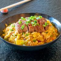 Wagyu Beef Fried Rice · Japanese style stir-fried rice with wagyu beef, beaten egg, and vegetables.