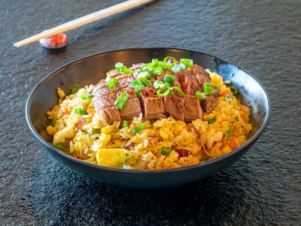 Wagyu Beef Fried Rice · Japanese style stir-fried rice with wagyu beef, beaten egg, and vegetables.
