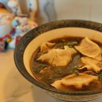 Hot & Sour Dumpling Soup · Pork or beef handmade dumplings swimming in hot 
and sour soup