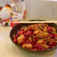 Szechuan Spicy Chicken · Deep-fried pieces of chicken, dried Szechuan chili peppers, 
spicy bean paste served with rice