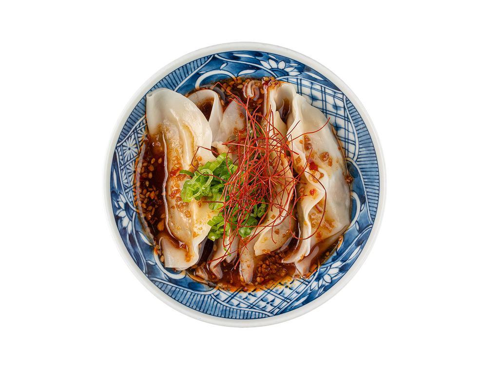 Steamed Dumpling · 4 pieces. Pork, green onion, ginger, cabbage, sesame, soy, chili threads.