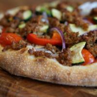 Berkeley Vegan · Housemade marinara sauce, vegan daiya cheese, vegan crumbles, roasted zucchini, cherry tomat...