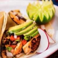 Grilled Fish Taco (3 Pieces) · Topped with pico de gallo, avocado, and Cotija cheese. Tacos topped with fresh onions and ci...
