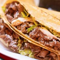 Steak Quesadilla · Choice of tortillas with cheese, lettuce and cotija cheese.