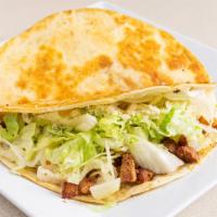 Spicy Pork Quesadilla · Choice of tortillas with cheese, lettuce and cotija cheese.