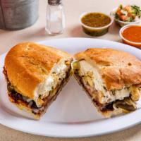 Chicken Torta · Mexican sausage, served on the telera toasted bread, coated with refried beans, mayonnaise, ...