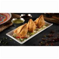 (3) Samosas · Fried pastry dough filled with baked potato, mixed with onions, peas, lentils, and served wi...
