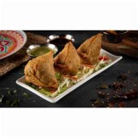 Keema Samosas (3) · Minced lamb meat, green peas, and special spices folded in fried pastry dough made with cumi...