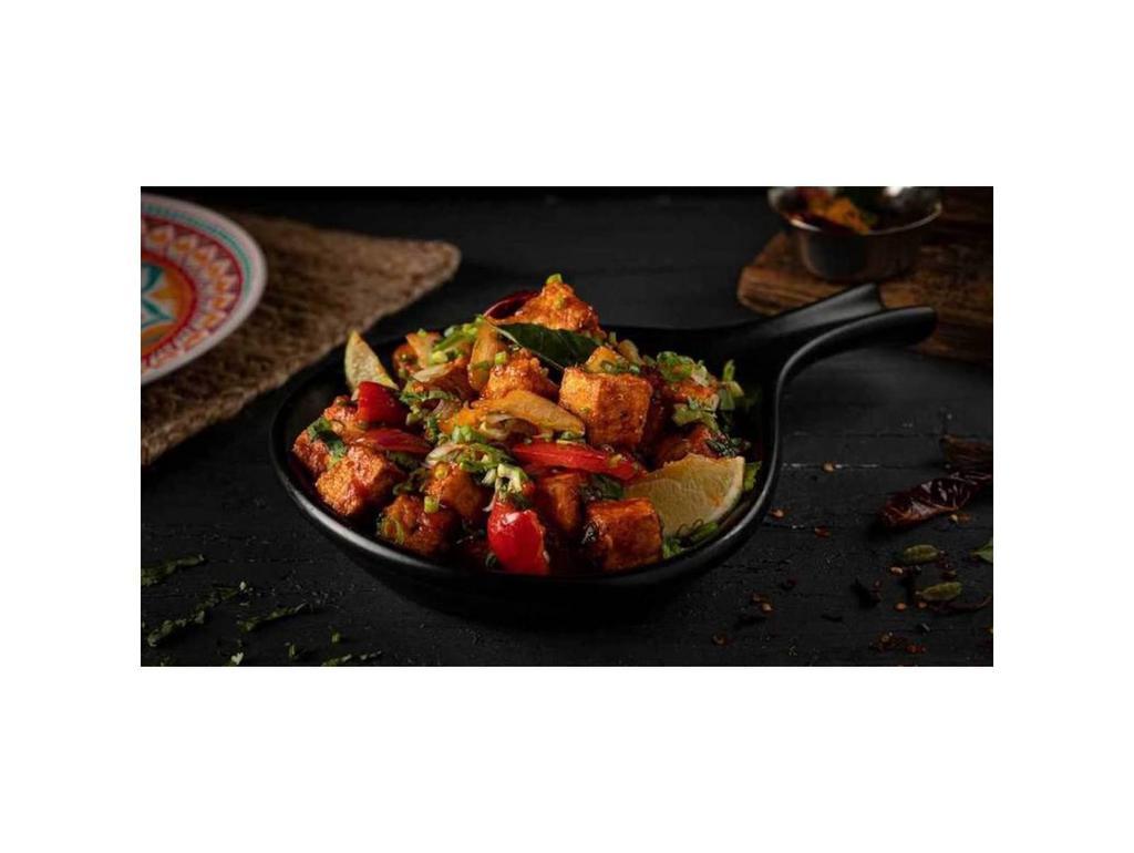 Chili Paneer · Deep fried paneer cubes sautéed with onions, bell peppers, and green chillies, tossed in our house special chili sauce
