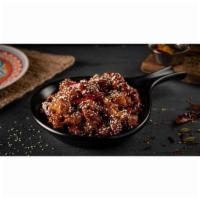 Sesame Chicken · Boneless chicken pieces flash-fried and tossed in special sweet & spicy sauce made with brow...