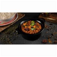 Channa Masala · Chickpeas cooked with diced onion, tomato, turmeric, and special South Indian curry
