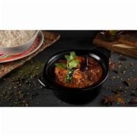 Paradise Chicken Curry · Chicken pieces cooked in tomato, onion, ginger-garlic paste with cumin seeds, curry leaves, ...
