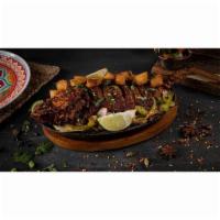 Whole Tandoori Snapper · Whole Red Snapper marinated in special masala, slowly roasted and pan-fried to crisp with ro...