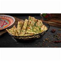 Chili Naan · Fresh home-made white bread baked with green chilis in clay oven