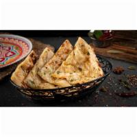 Garlic Cheesy Naan · Fresh home-made white bread baked with minced garlic, cilantro, and stuffed with cheese in c...