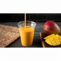 Mango Lassi · Traditional popular mango-flavored shake made with fresh yogurt