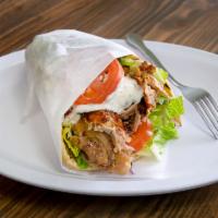 Chicken Doner Wrap · Marinated chicken vertically roasted. Served with lettuce, tomato, onions and tzatziki sauce.