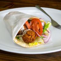 Falafel Wrap · Croquettes of spicy ground chickpeas. Served with tahini sauce. Includes lettuce, tomato, on...