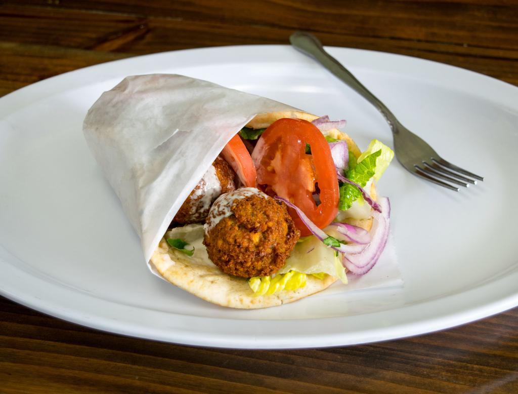 Falafel Wrap · Croquettes of spicy ground chickpeas. Served with tahini sauce. Includes lettuce, tomato, onions and tzatziki sauce.