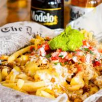 Supreme Fries · French fries, pico, avocado, nacho cheese, sour cream and choice of meat. Gluten free.