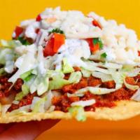 Classic Tostada · Corn tostada, sour cream, beans, pico, cheese and lettuce. Choice of vegan meat. Gluten free.