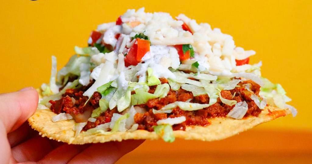 Classic Tostada · Corn tostada, sour cream, beans, pico, cheese and lettuce. Choice of vegan meat. Gluten free.