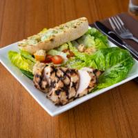 Modern Caesar Salad · Chopped romaine tossed with creamy Caesar dressing, grape tomatoes, Parmesan cheese and hous...
