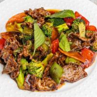 21. Thai Basil Beef · Thai style tender beef with green and red pepper, broccoli, carrot and basil leaves in a spi...