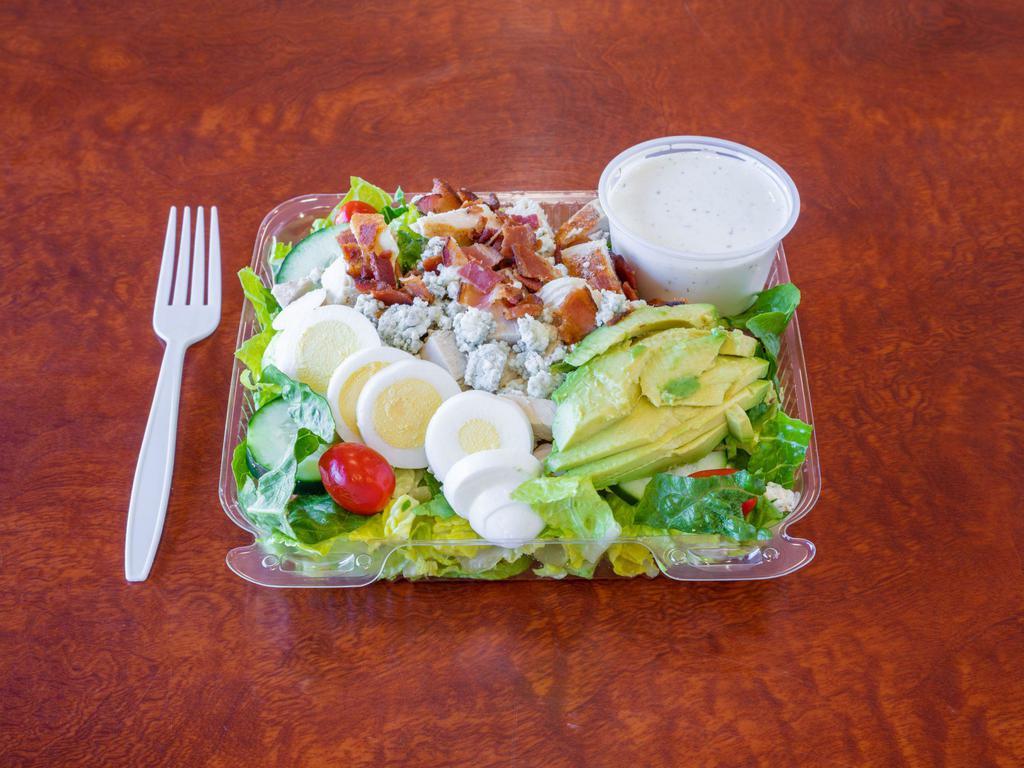 Classic Cobb Salad Meal · Romaine, chicken, bacon, sliced boiled egg, cucumbers, bleu cheese crumbles, avocado, and cherry tomatoes with choice of dressing.